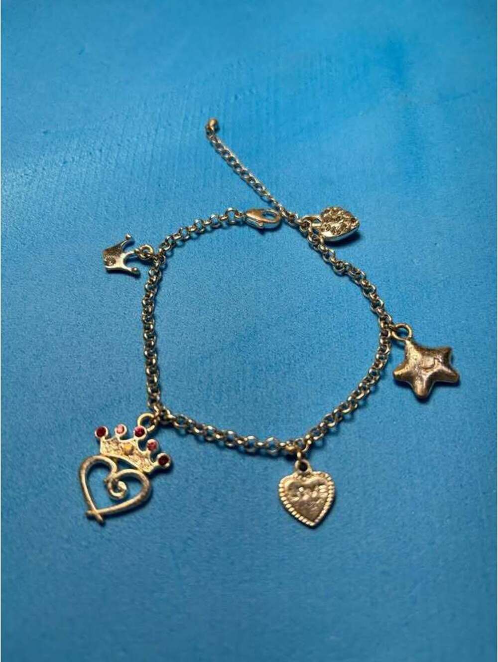 Gold-Toned Charm Bracelet with Heart, Star, and Crown Charms